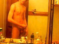 Curly-haired twink in bathroom