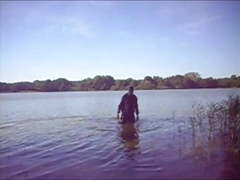 Swimming with PVC suit in the lake